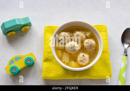 chicken soup for children on gray background Stock Photo