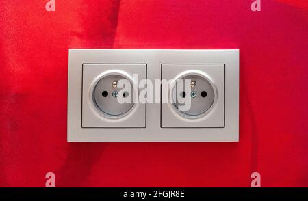 Classic simple european eu double electrical outlet, 220W sockets on the wall, socket object detail, macro, closeup, front view, frontal shot Electric Stock Photo