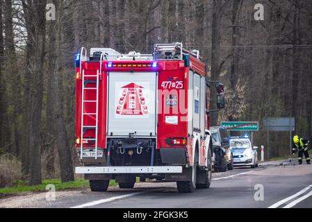 Warsaw, Poland - April 20, 2021: Fire truck on the road. Rescue operation after a car accident. Stock Photo