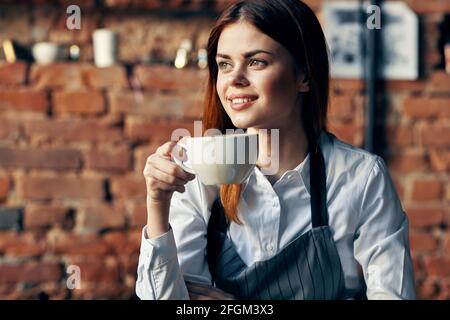 woman waiter coffee cup service restaurant lifestyle Stock Photo