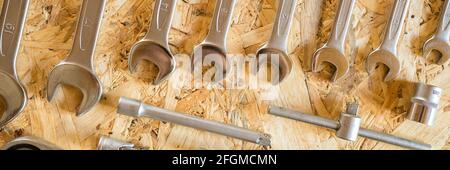 set of various repair hand tools or auto mechanic's tools. repair tool kit. equipment for building. wooden background, pattern, top view Stock Photo
