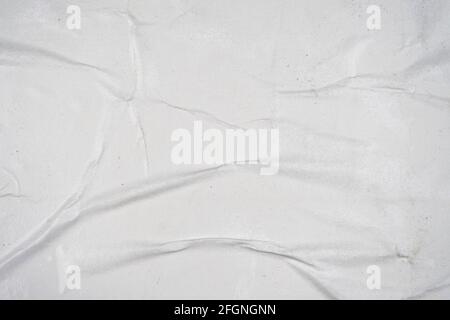 White old ripped torn paper background. Blank creased crumpled dirty posters grunge textures placard surface Stock Photo