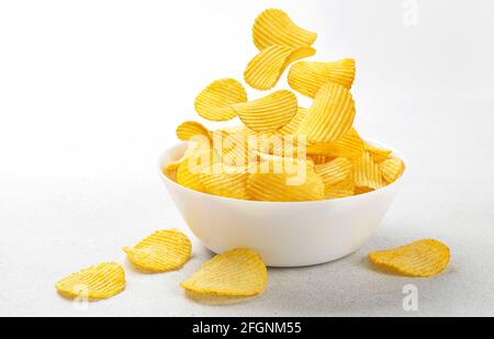 Ridged potato chips isolated on white background Stock Photo