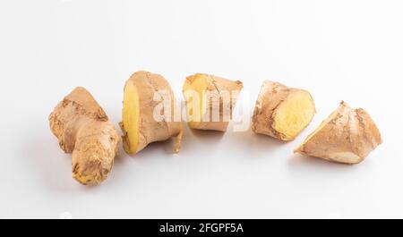 Close-up on a sliced ginger root on white background Stock Photo