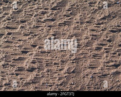 Wind blown sand on the Solway Coast, Cumbria, England, UK, taken at the end of a sunny day with a setting sun casting shadows. Stock Photo