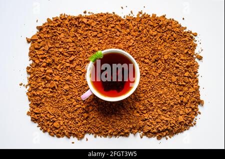 chaga mushroom tea. a cup of brewed tea from birch fungus chaga on a pile of small broken pieces isolated on white background Stock Photo