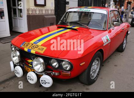 Cracow. Krakow. Poland. Red Lancia Fulvia 3 with additional heandlamps parked on the street. Stock Photo