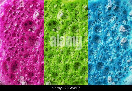 Multi-colored foam of three colors, pink, green and blue in a row. Conceptual color background Stock Photo