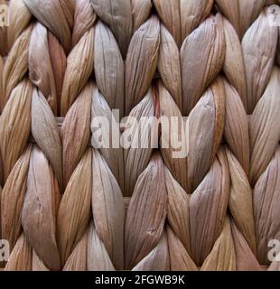 Fun frame natural plaited or woven coarse dried grass background Stock Photo