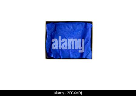 Opened flat rectangular cardboard box with blue crumpled wrapping paper top view isolated on white Stock Photo