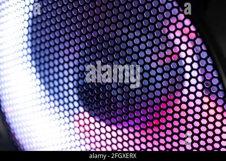 Detail of the case of a gaming pc with fan illuminated by rgb led and protection net Stock Photo