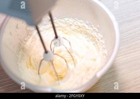 Mixer whips cream cake. Close-up. Close up Stock Photo