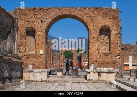 Honorary Arch next to the Temple of Jupiter in ancient Roman city of Pompeii in Pompei, Campania, Italy Stock Photo