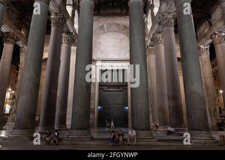 Corinthian columns of the Pantheon monumental portico at night, ancient Roman temple from 125 AD in city of Rome, Lazio, Italy Stock Photo