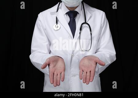 Doctor with stethoscope on black background Stock Photo