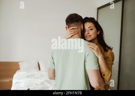 Happy young couple is hugging and showing their feelings, close up. Young family moving to new apartment Stock Photo