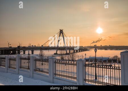 October bridge in Cherepovets, Vologda region, Russia. Winter morning sunrise landscape Stock Photo