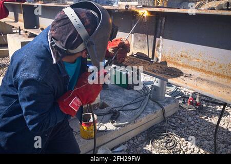 Welder on a construction site Stock Photo