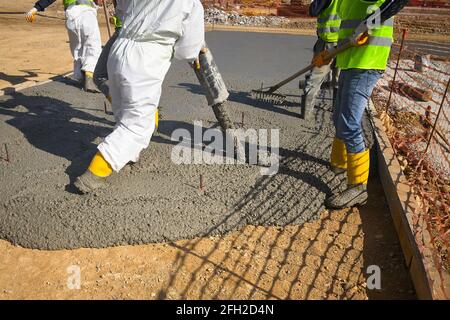 Construction workers pour a concrete Stock Photo