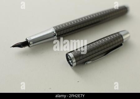 Beautiful grey fountain pen on white background. Stock Photo