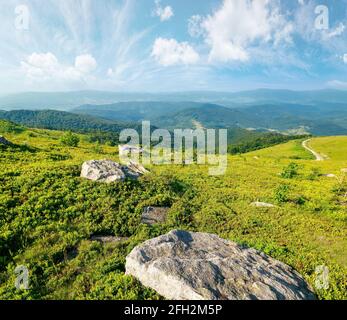 Fluffy clouds above valley landscape photo Stock Photo - Alamy