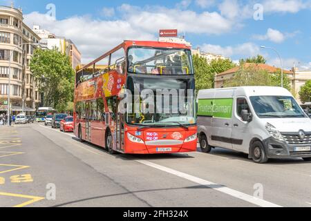 Palma de Mallorca, Spain; april 23 2021: Tourist bus driving around the Plaza de España in Palma de Mallorca, tourists wearing face masks in times of Stock Photo