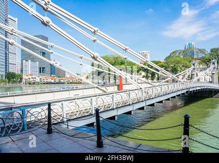 Cavenagh Bridge over the Singapore River is one of the oldest bridges and the only cable-stayed suspension bridge in Singapore. Stock Photo