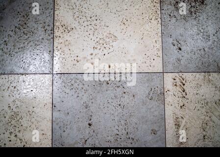 Wet and dirty checkered ceramic floor Stock Photo