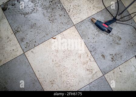 Wet and dirty checkered ceramic floor Stock Photo