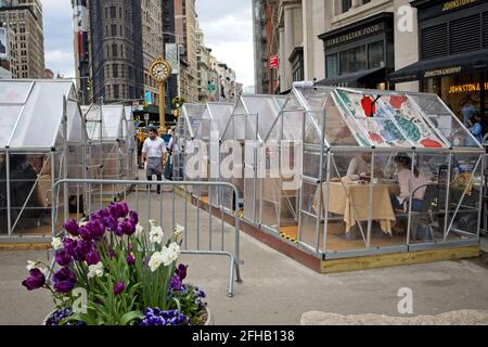 New York, NY, USA - Apr 24, 2021: Outside dining near Eataly with private dining enclosures on Broadway above 23rd Street in Manhattan Stock Photo