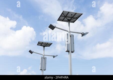 Outdoor solar cell LED flood light on blue sky Stock Photo