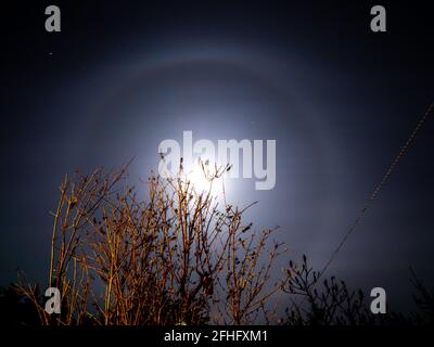 Halo ring of light around the moon Stock Photo
