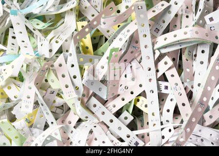 The discarded paper edges from fanfold continuous stationery, recycle or reuse for shockproof material Stock Photo