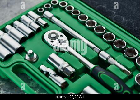 Set of spanners with ratchet in green toolbox Stock Photo