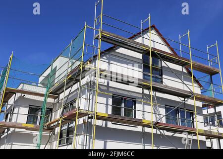 Scaffolding: Scaffolded family house Stock Photo