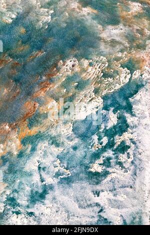 Sea surf with diagonal waves on an abstract plaster textured drawing in interior design. Vertical image. Stock Photo