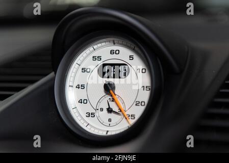 Dashboard guage gives an accurate readout of minutes and hours in analog or digital clock face. Stock Photo