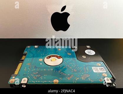 Mac 21,5 inch personal computer made by Apple Computers and MX500 5.5 inch solid state drive Stock Photo