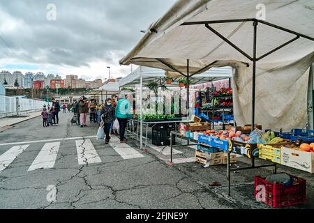 LANDABEN, PAMPLONA SPAIN FEBRUARY 07 2021: OUTDOOR MARKET FOR VEGETABLES, FRUITS AND MEATS IN THE LANDABEN NEIGHBORHOOD Stock Photo