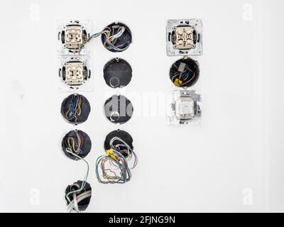 Refurbishment of a socket and light switch in the house Stock Photo