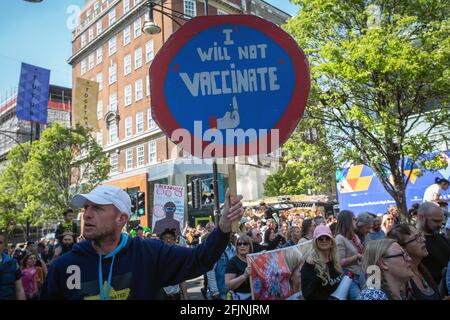 April 24,2021, London,England, United Kingdom:  A Man holds a sign “I will not vaccinate.”during an anti-lockdown'Unite for Freedom' protest in London. Stock Photo
