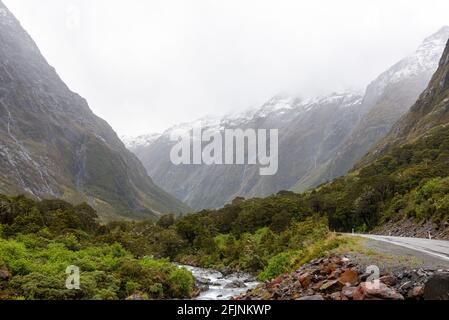 Mountainous Monkey creek flowing through impressive landscape next to Milford Sound highway, South Island of New Zealand Stock Photo