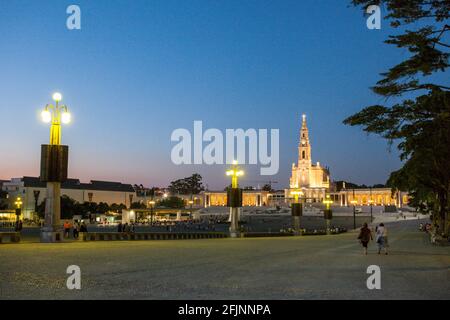 The sanctuary of Fatima at dusk on a summer night, where Christians pilgrims traditionally  meet in May and October of each year - Portugal. Stock Photo