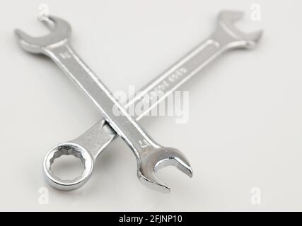 Two metal spanners on plain background Stock Photo