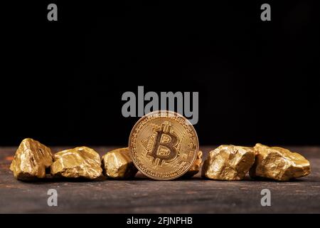 Bitcoin cryptocurrency with gold nuggets. Investment and store of value concept. Stock Photo