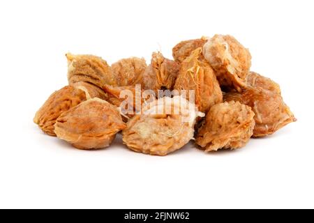 handful of wet peach seed with pulp leftovers isolated on white background Stock Photo