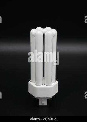 Compact fluorescent lamp. Close-up. Isolated on black. Stock Photo