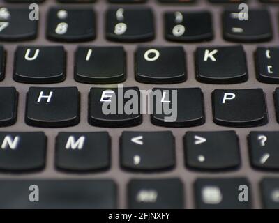 Computer keyboard with keys spelling out the word help. Stock Photo