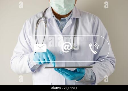 doctor  show plese Contact Us line contact hand telephone  email address on Website page contact us or e-mail Stock Photo