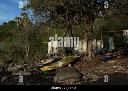 Fishing nets and fishing boats on the beach of 'Lamalera B' in Lamalera village, Lembata Island, East Nusa Tenggara, Indonesia. Stock Photo